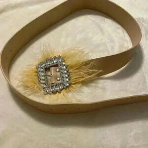 Women’s belt NWOT cream colored belt with rhinestones & feathers on buckle